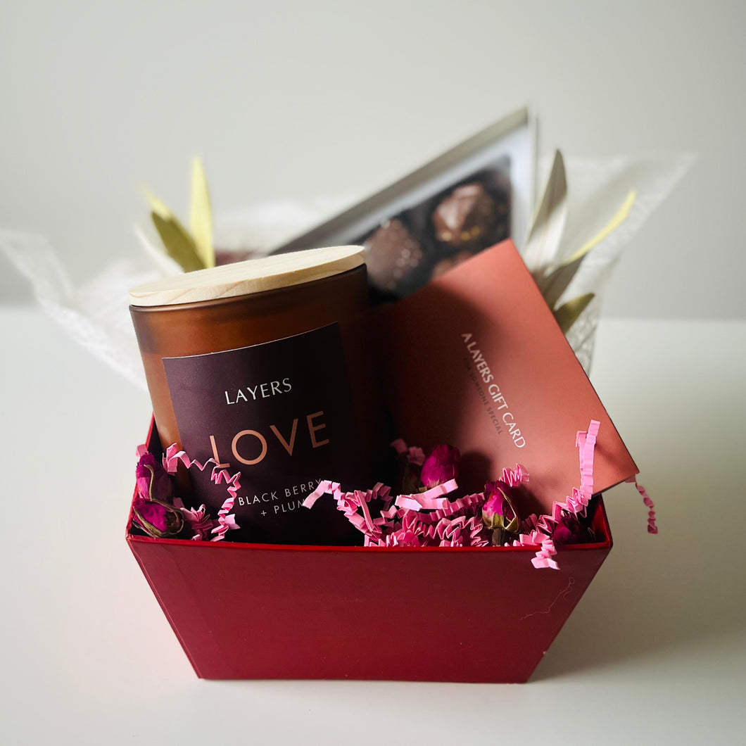 Image of Valentine's Day flowers, chocolates, and candle gift box in Fort McMurray, Alberta.